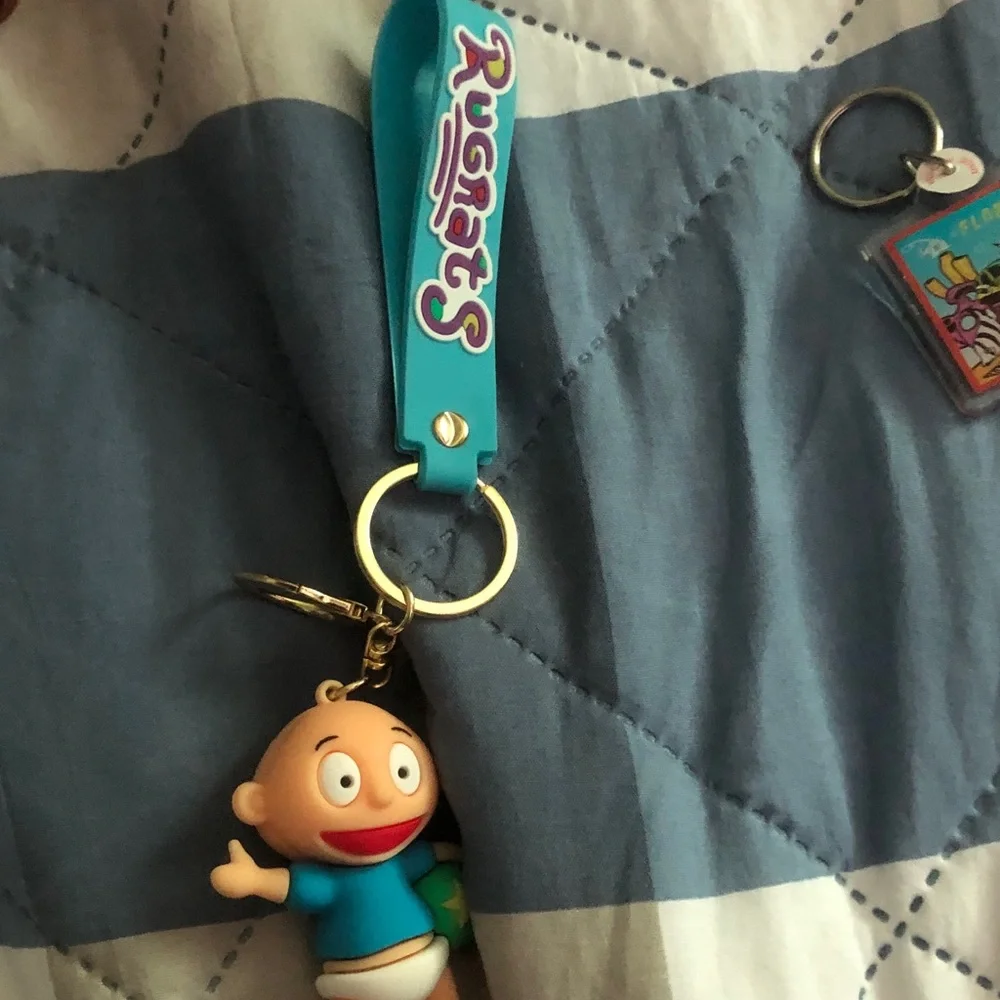 Cute Baby Character Keychain on Teal Wrist Strap